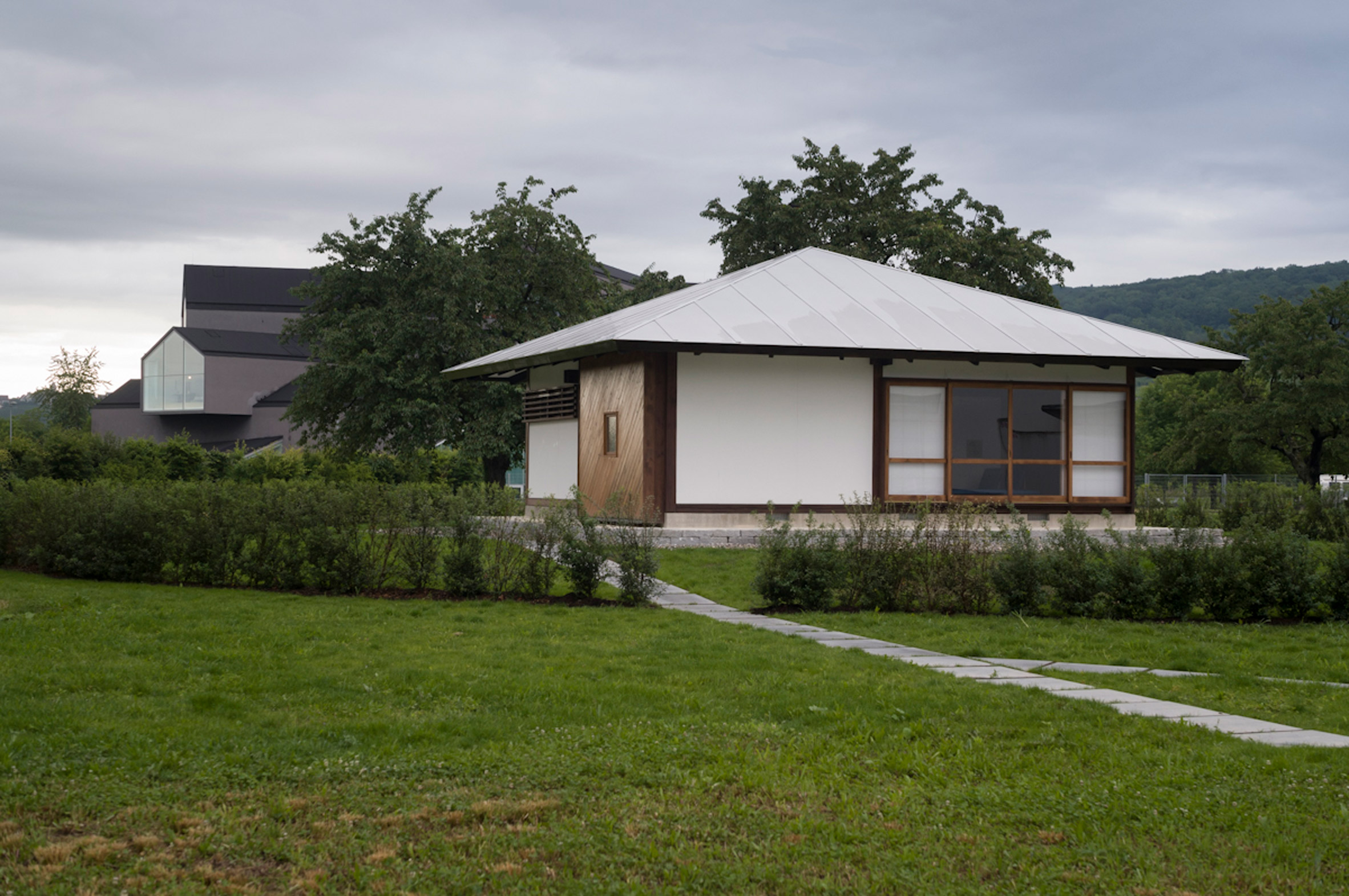 Shinohara's house now stands by VitraHaus by Herzog & de Meuron