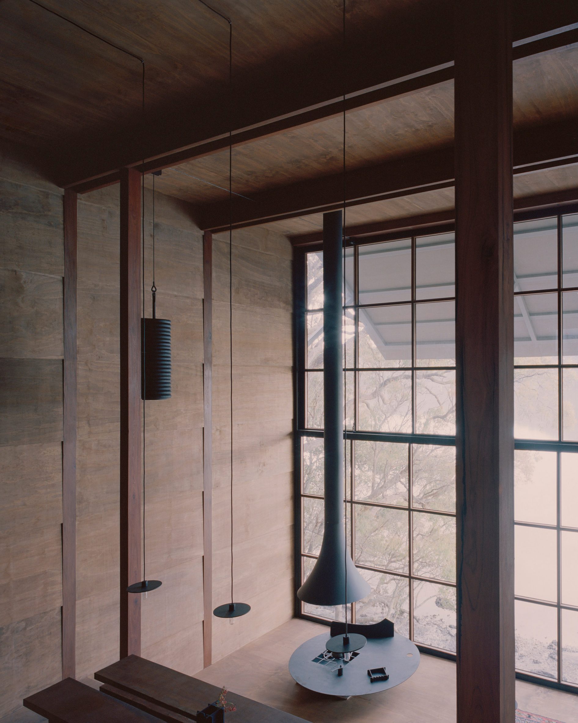 Image of the interior of the wooden house with views of the creek