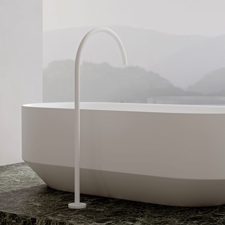 RYO bathtub on a green marble slab and freestanding tap