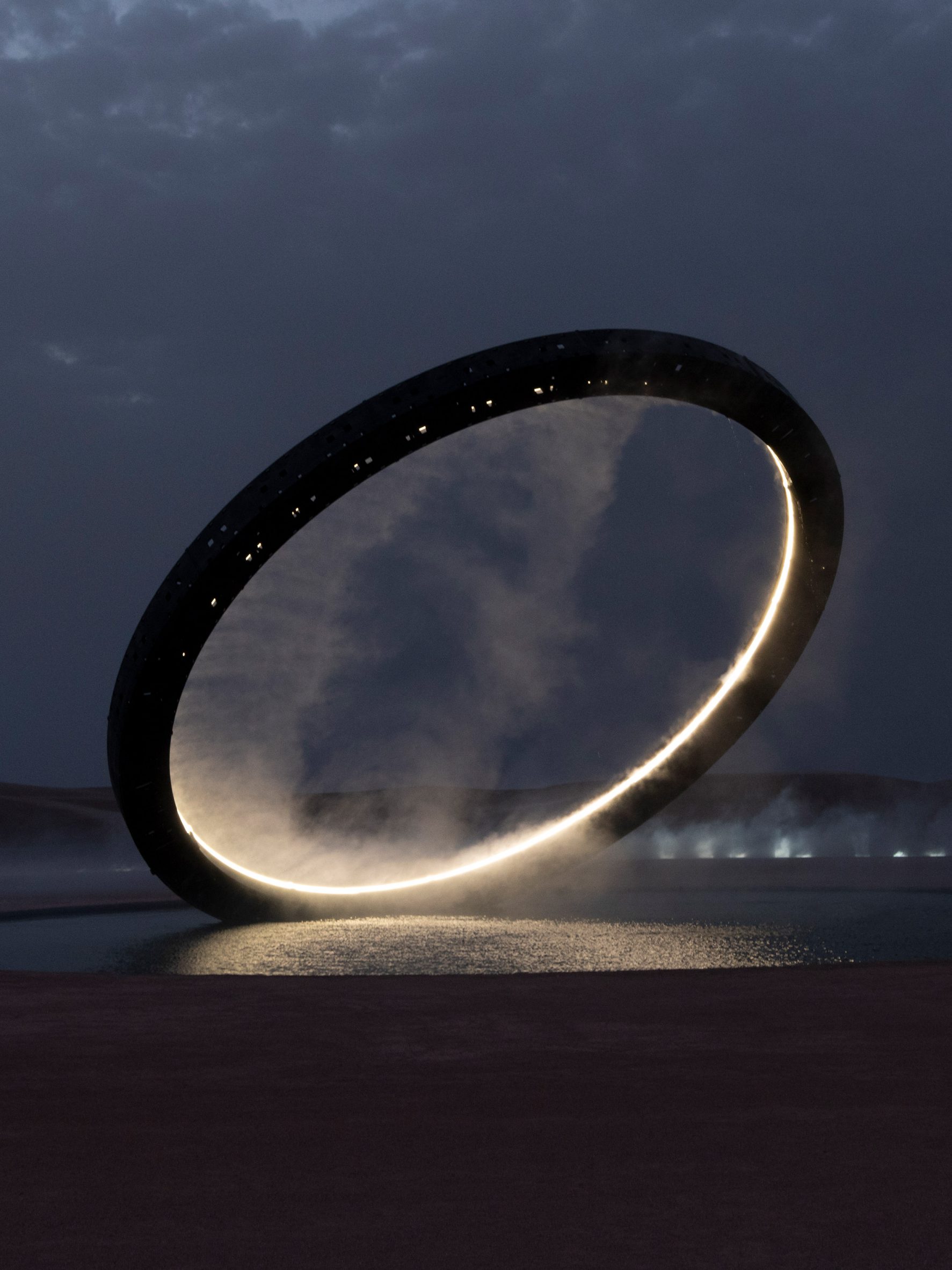 The illuminated ring by Es Devlin is pictured at glowing at night