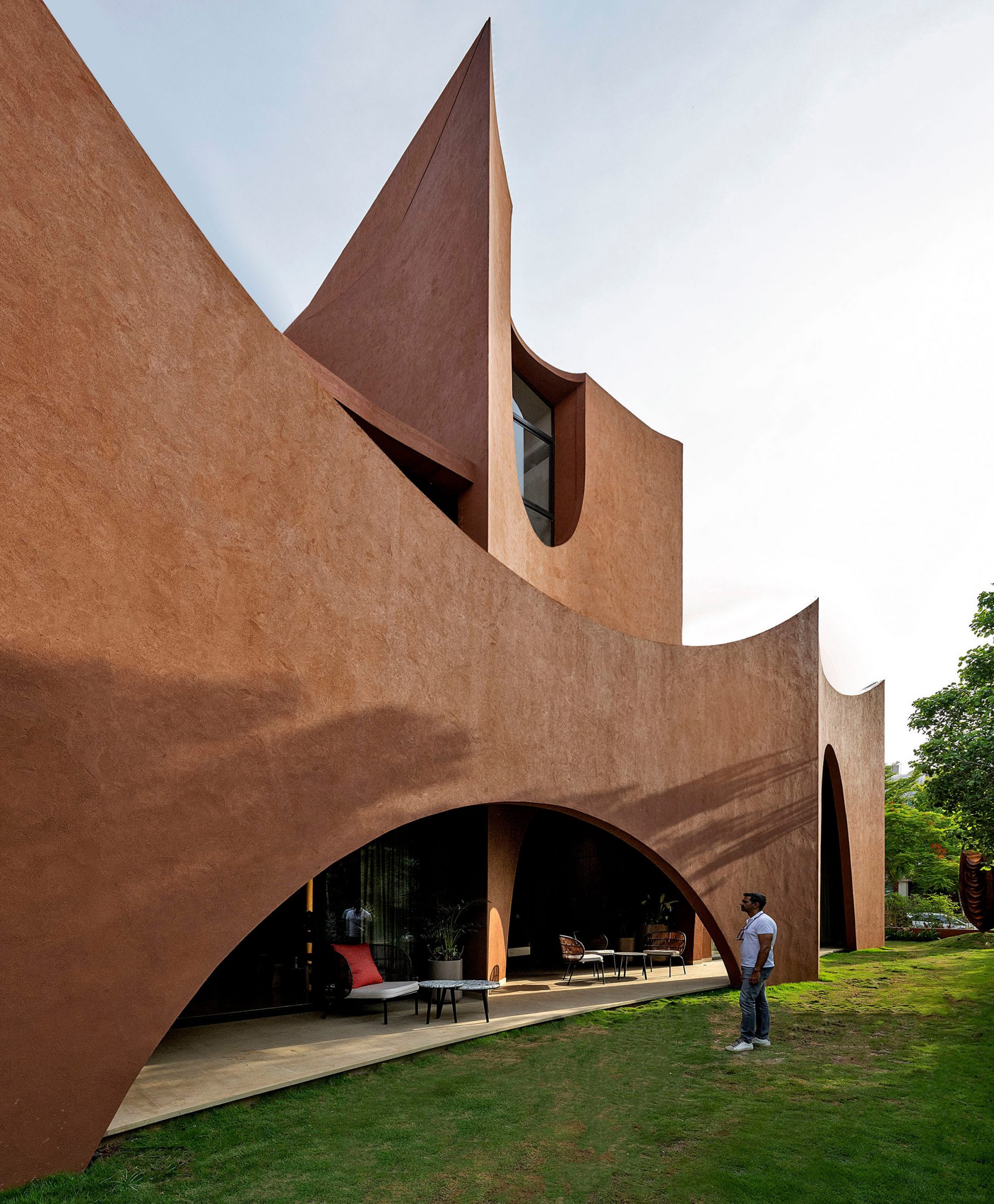 Exterior image of a person stood next to Mirai House of Arches