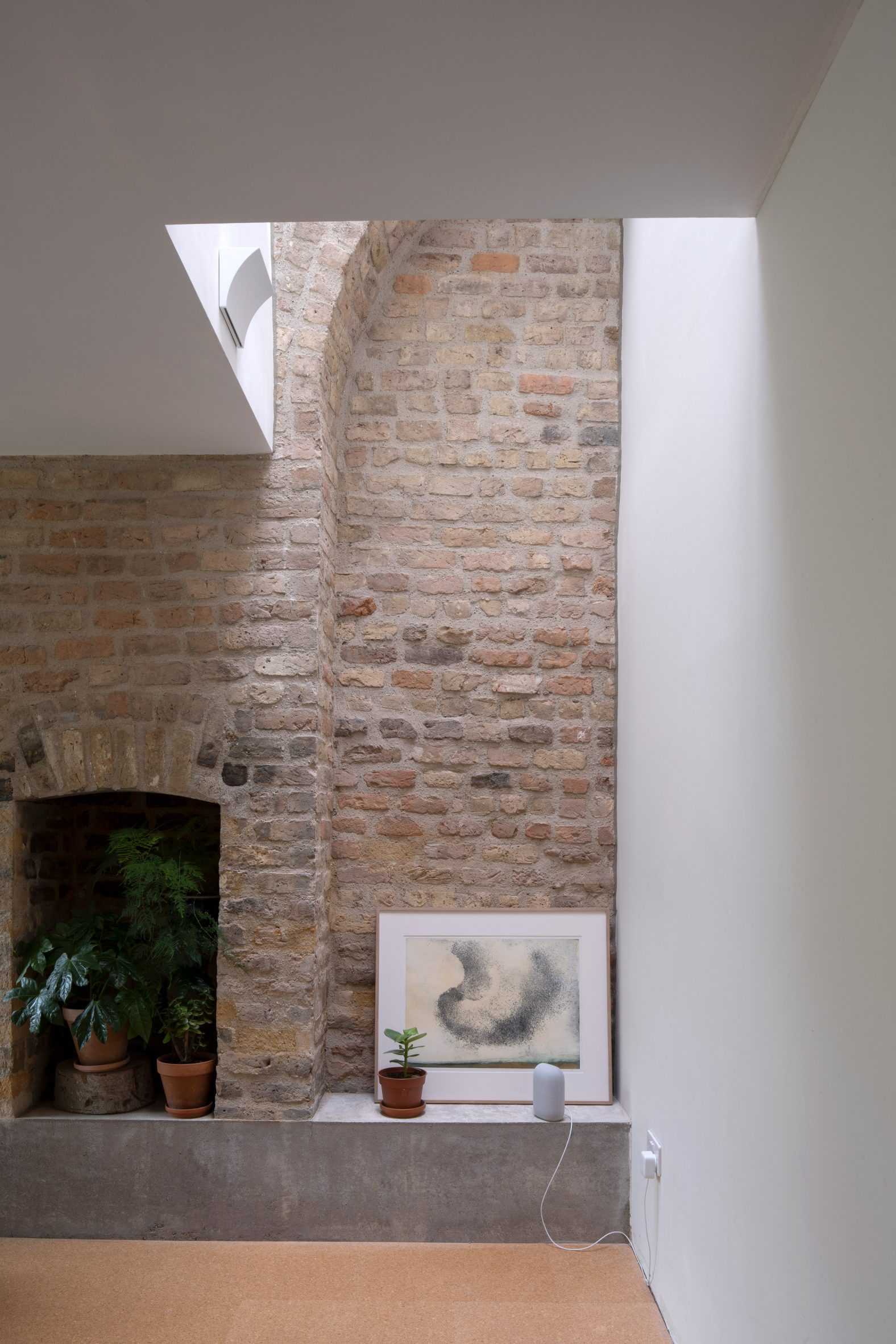 Brick wall inside Dublin cottage extension by Scullion Architects