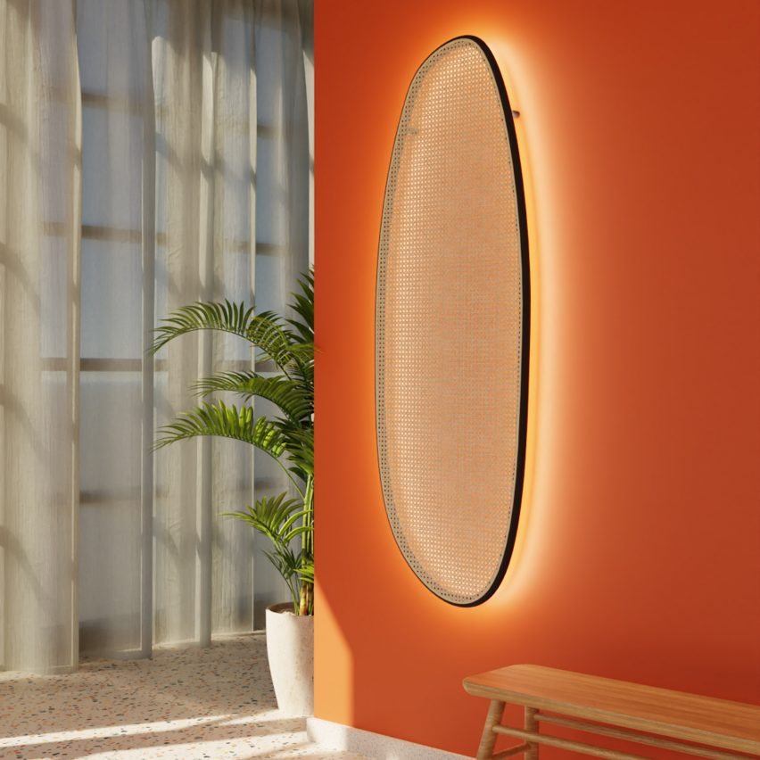 Sisu wall light by Studio Rik ten Velden on an orange wall in a hallway