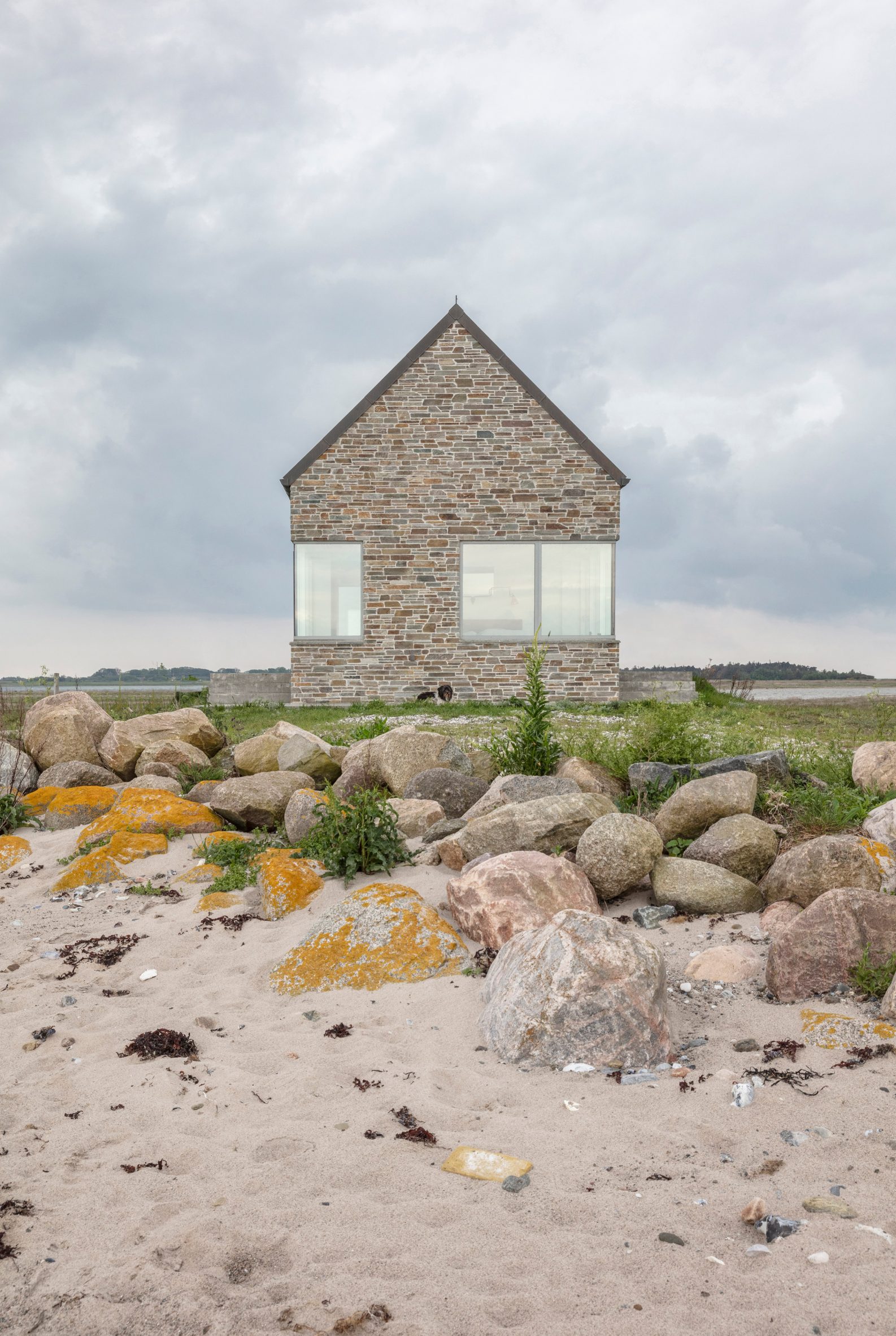 Stone-clad Danish house by GinnerupArkitekter