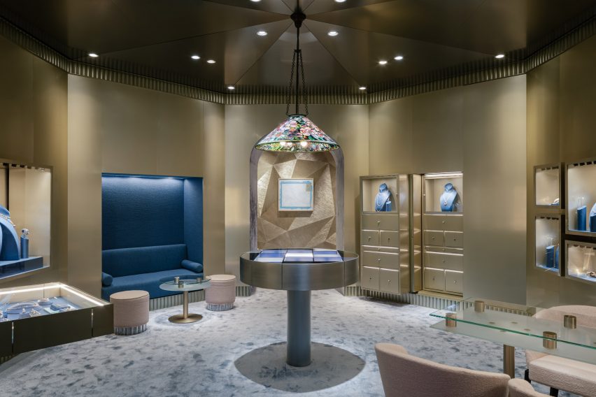 Jewellery store designed by OMA with gold-coloured walls and a central display table