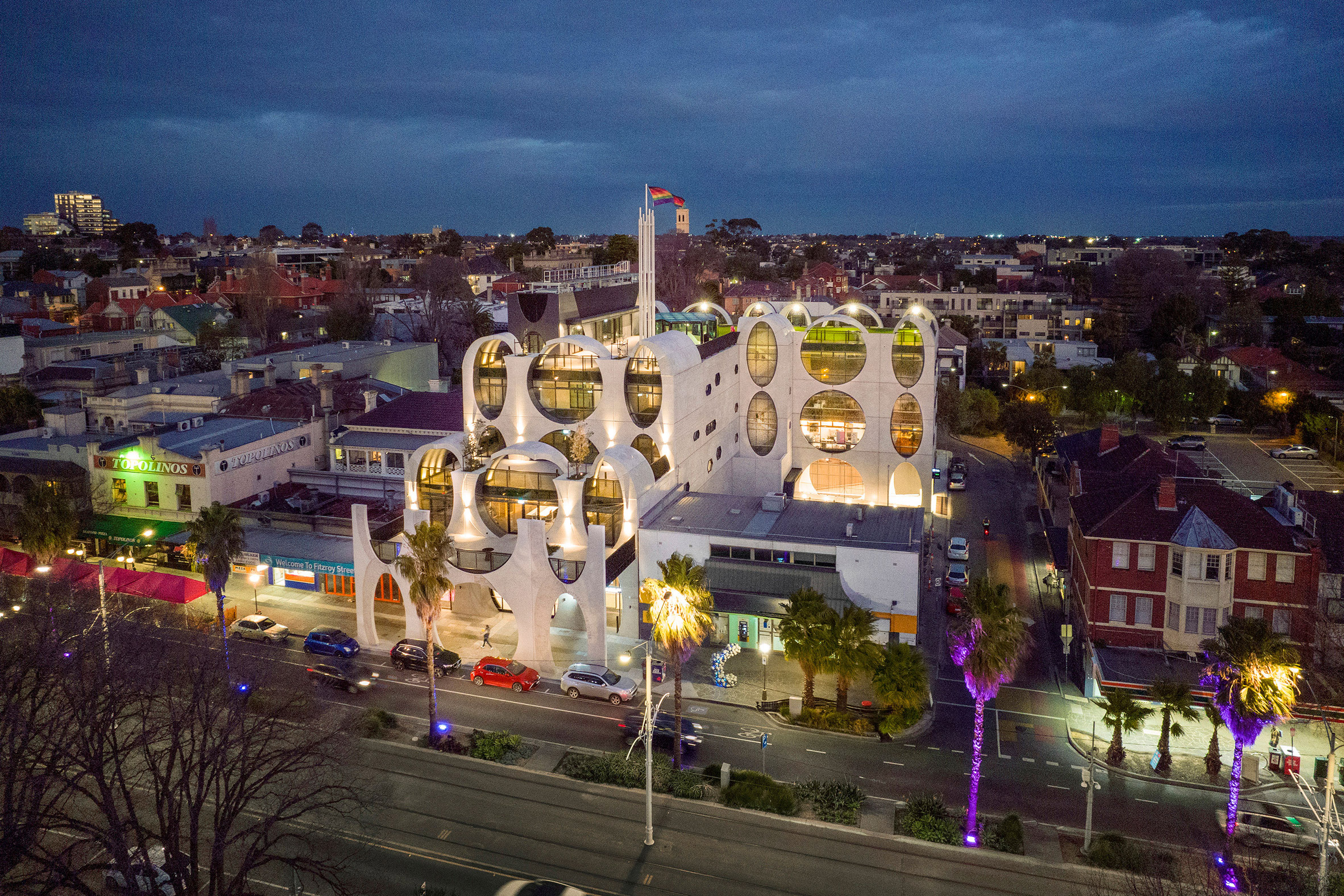 Aerial image of The Victorian Pride Centre lit at night