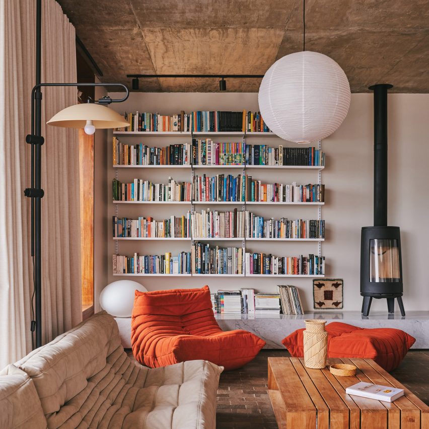 Living room with bookcase and concrete ceiling
