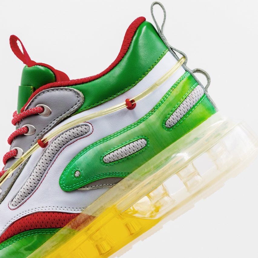 A close-up photograph of Heinekicks sneakers with a transparent sole filled with beer