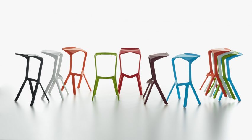 Colourful polypropylene stools lined up and stacked