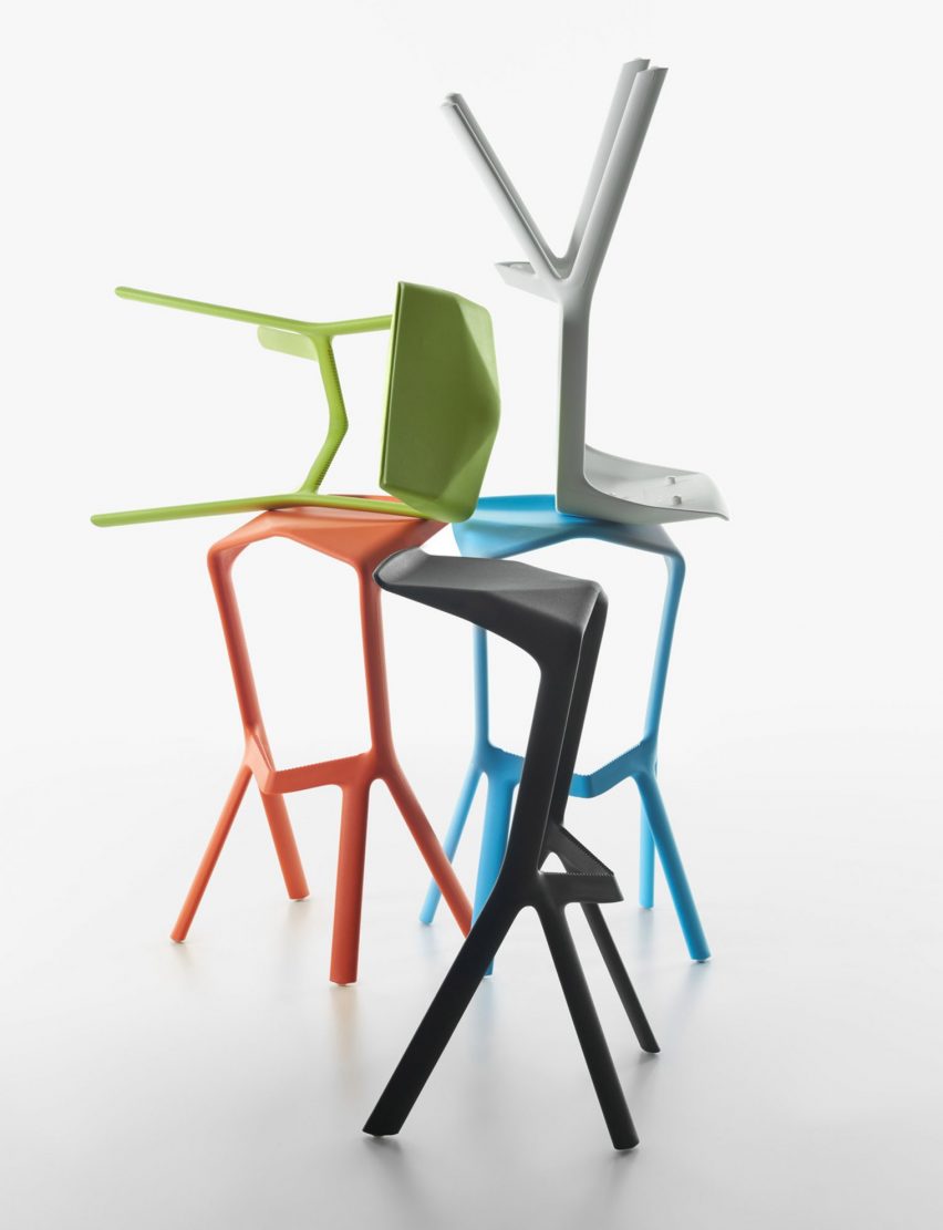 Colourful polypropylene stools on top of each other