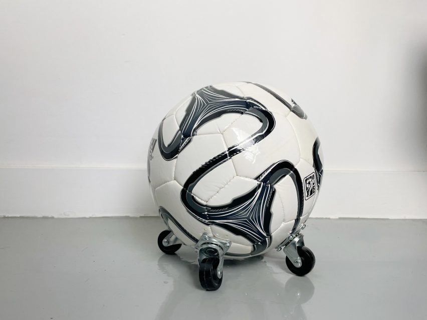 A photograph of a football with wheels