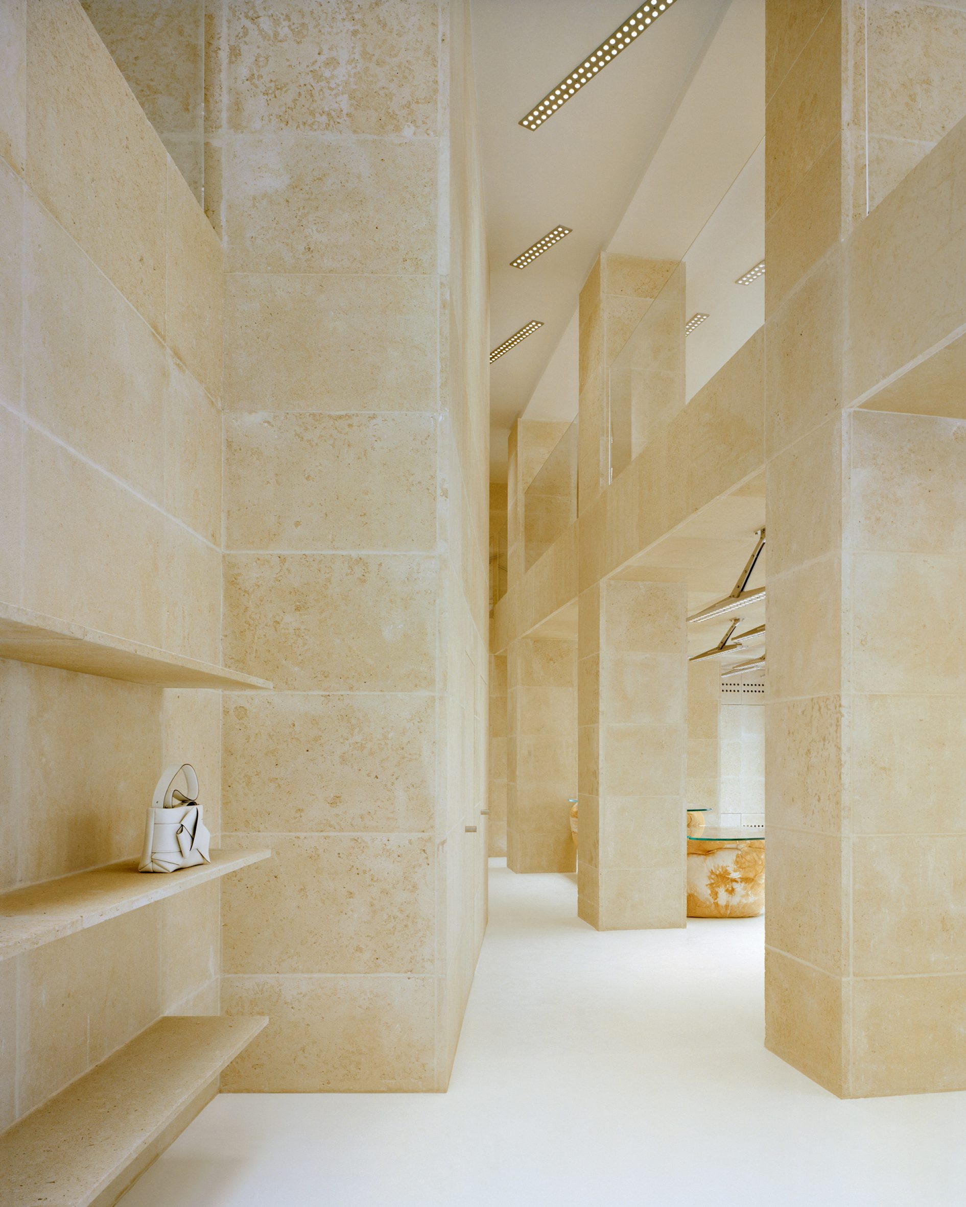 Interior image of the limestone-clad Acne Studios Rue Saint Honoré