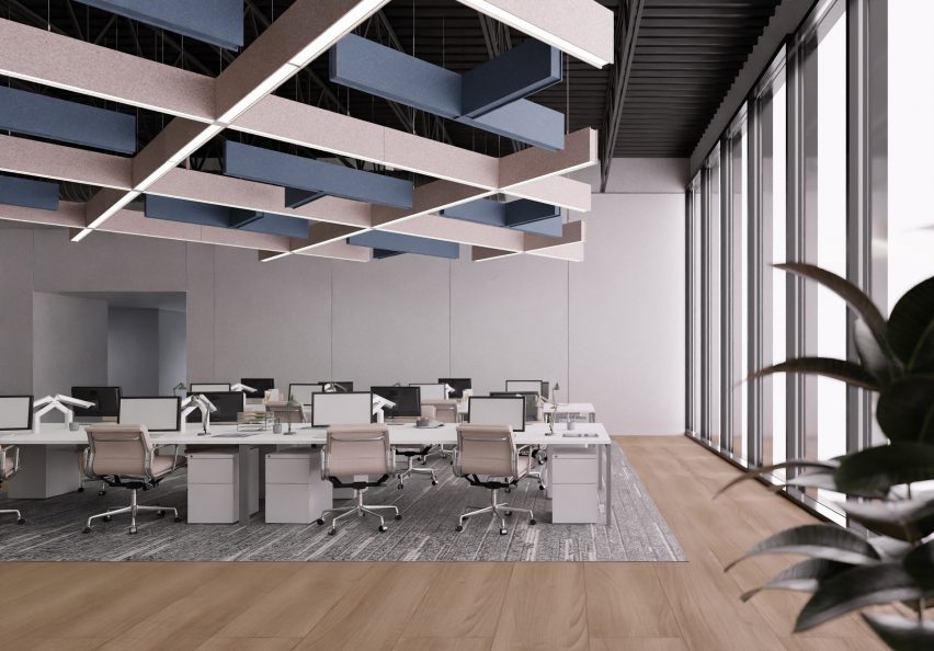 Photograph showing an office space with grey and beige acoustic lighting grid on ceiling