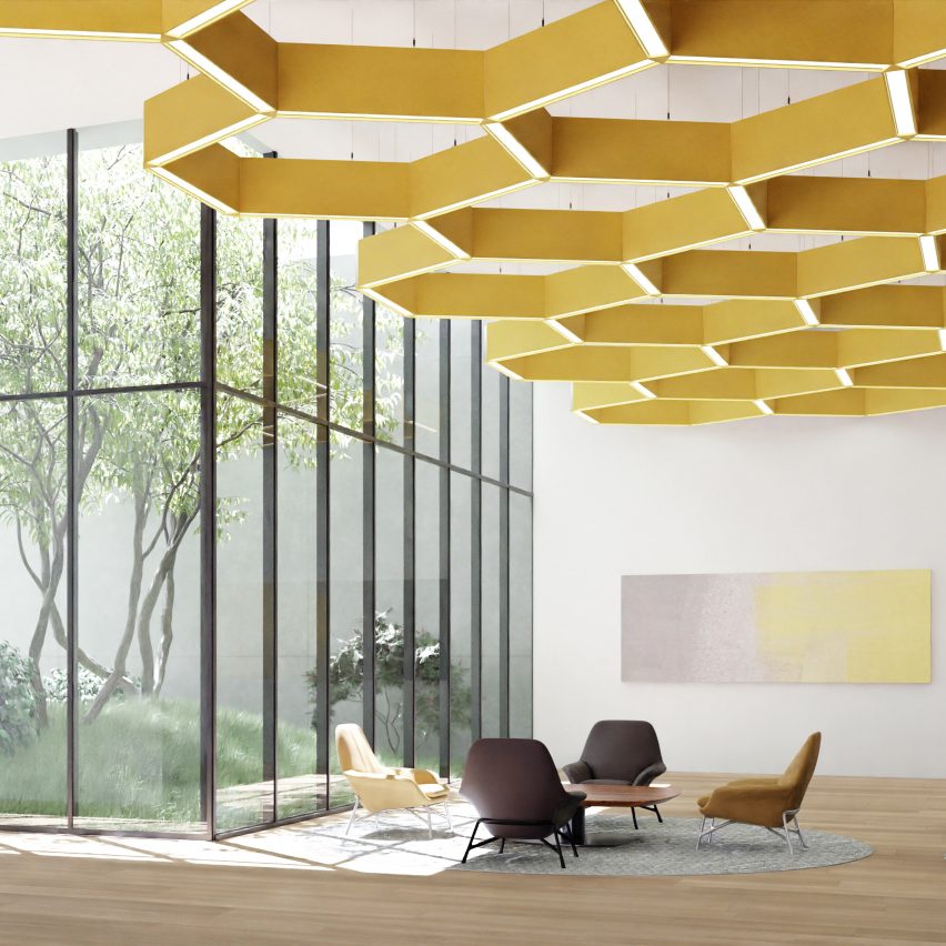Photograph showing a seating area with large window and yellow honeycomb-patterned acoustic lighting grid on ceiling