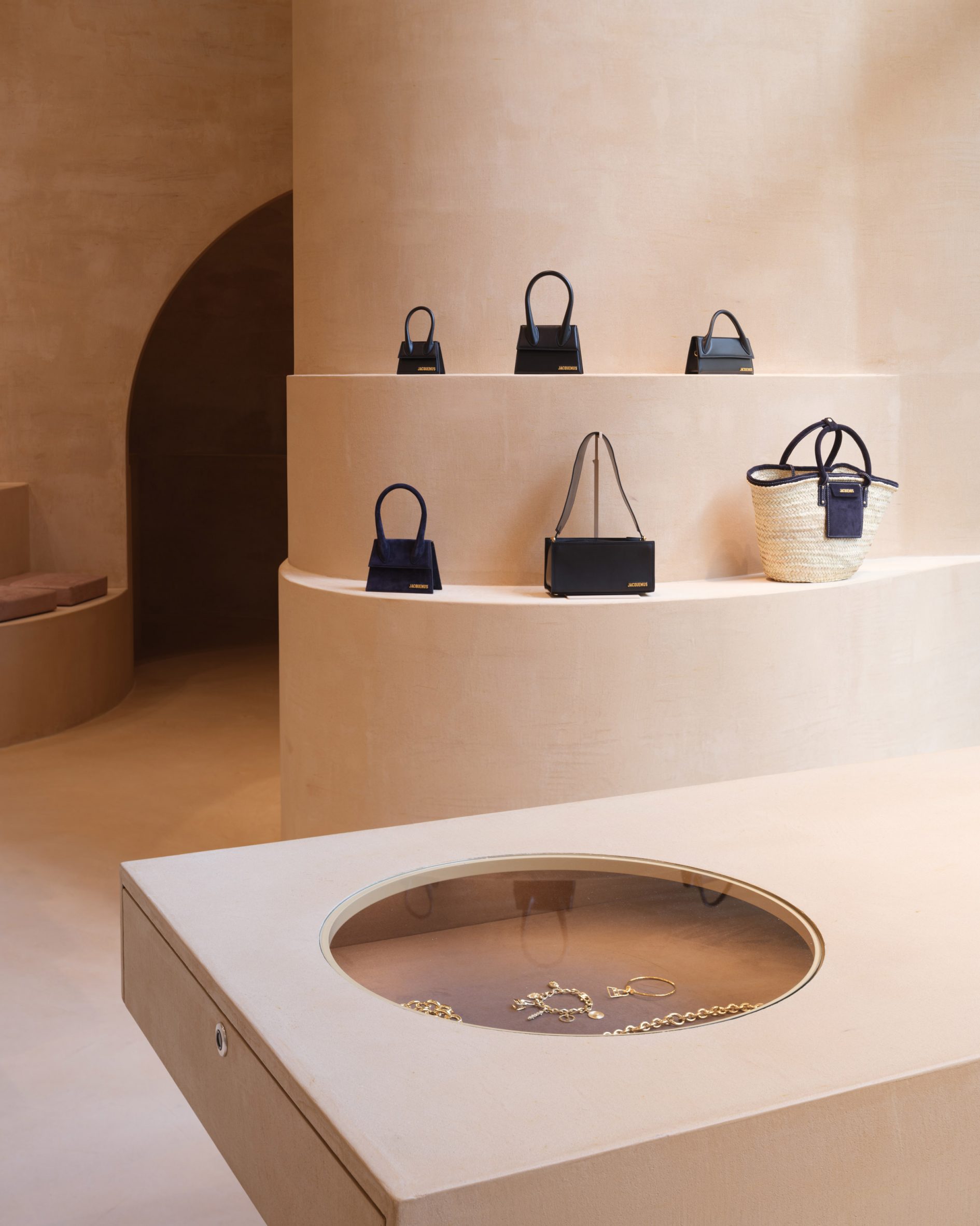 Bags are pictured on clay display shelves at the Jacquemus Selfridges store