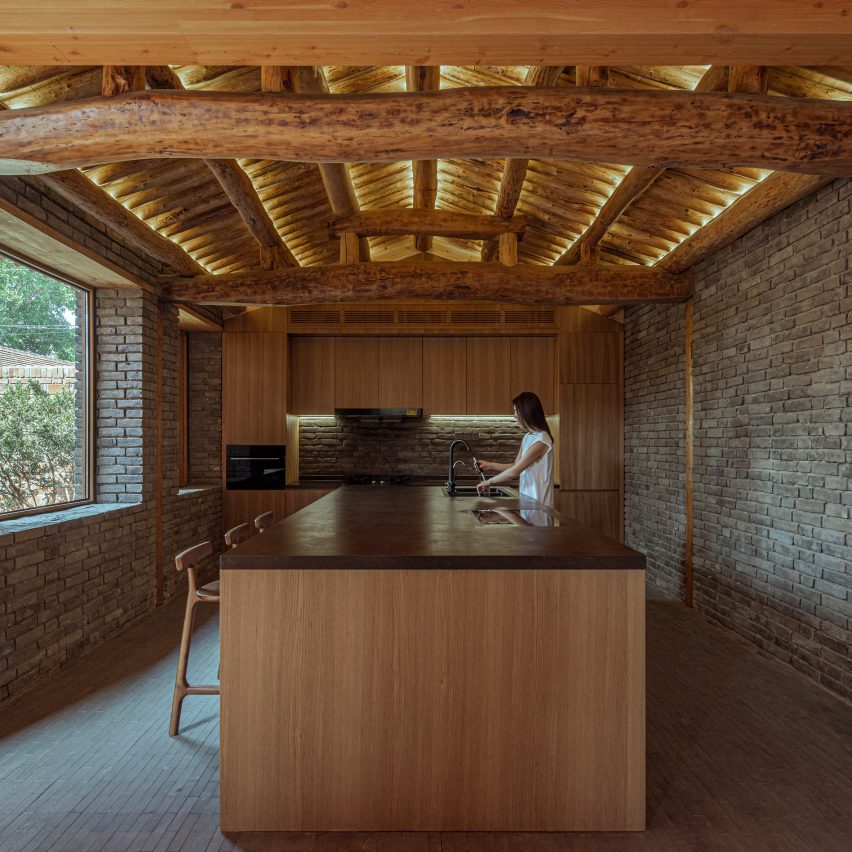 Interior of a wood and brick kitchen