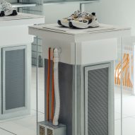 Image of trainers displayed on a plinth
