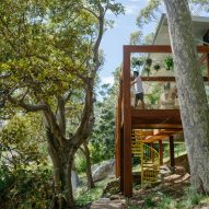 Balmy Palmy House perches above steep Australian bushland