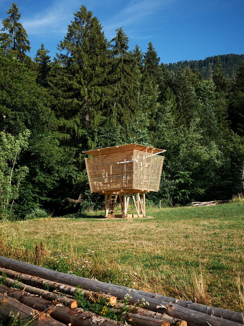 A wooden hut on stilts called Impluvium