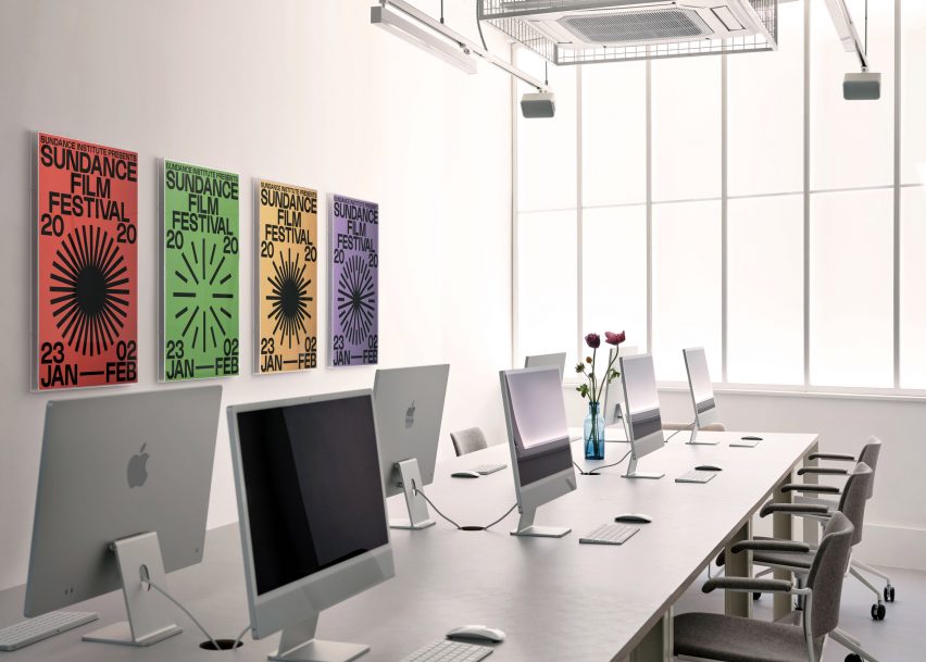 Crisp white office and gallery space with long meeting table