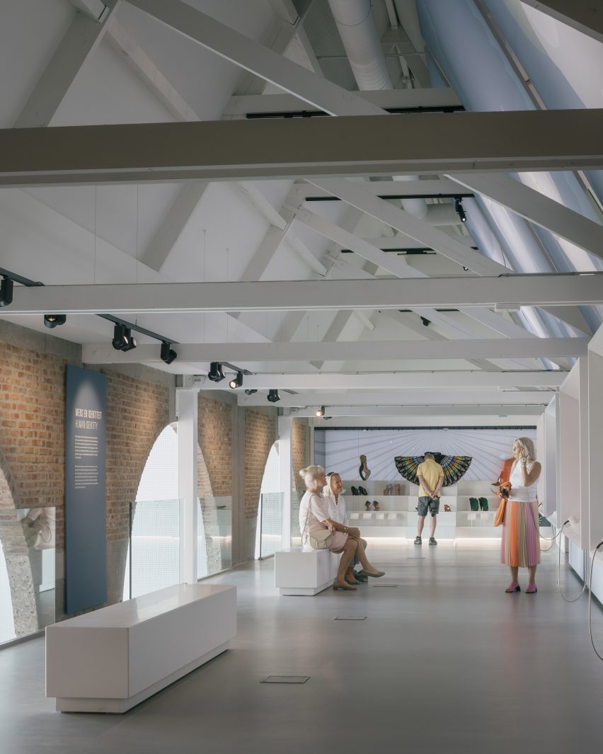 White beams decorate the ceiling in the Shoe Museum