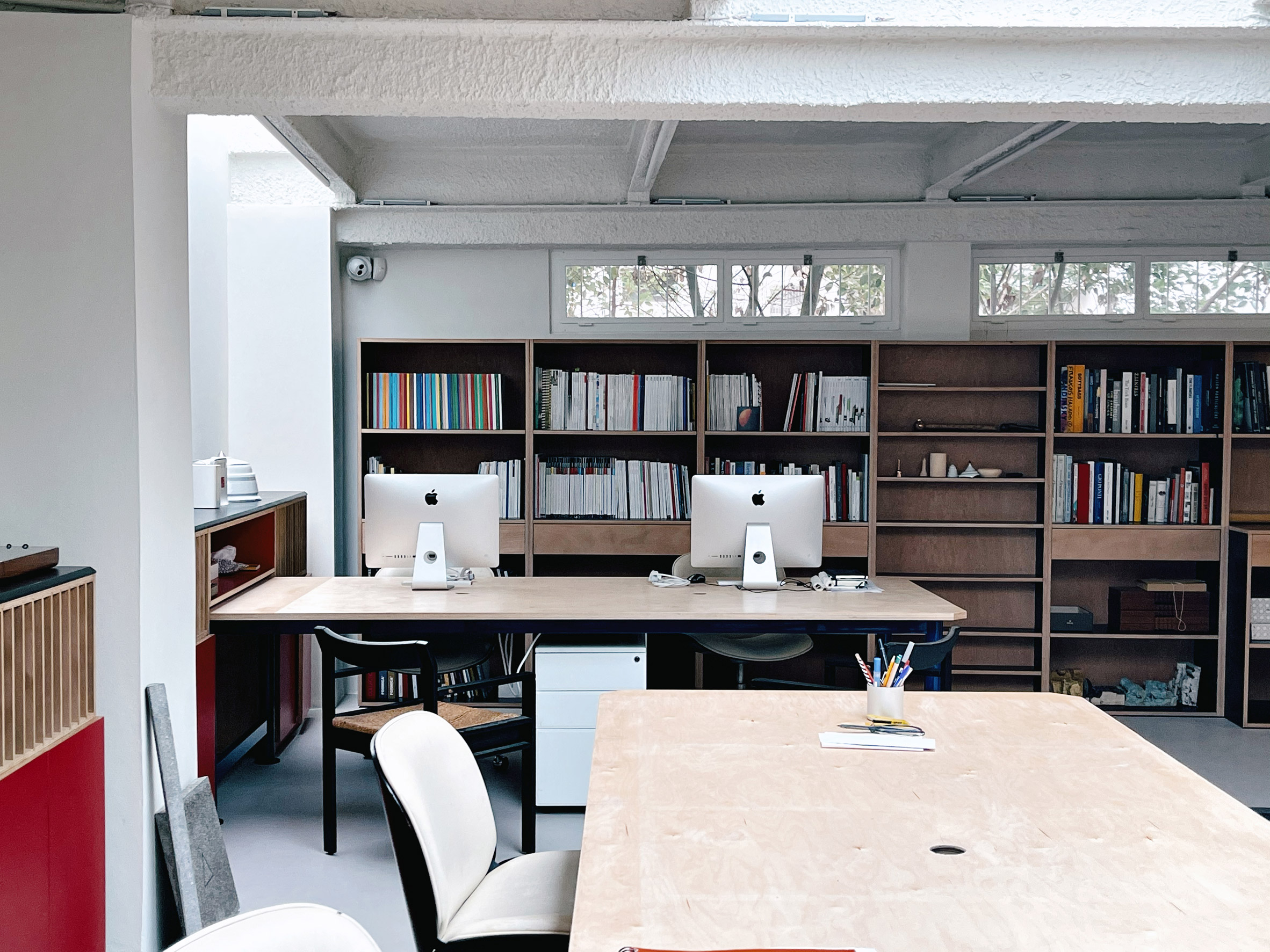 An office in Beirut with filled bookshelves and wooden desks 