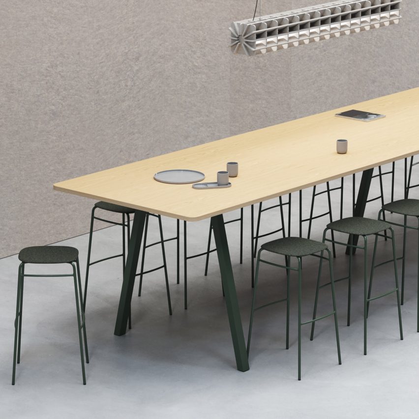 Large modular table by De Vorm with green steel legs and green bar stools