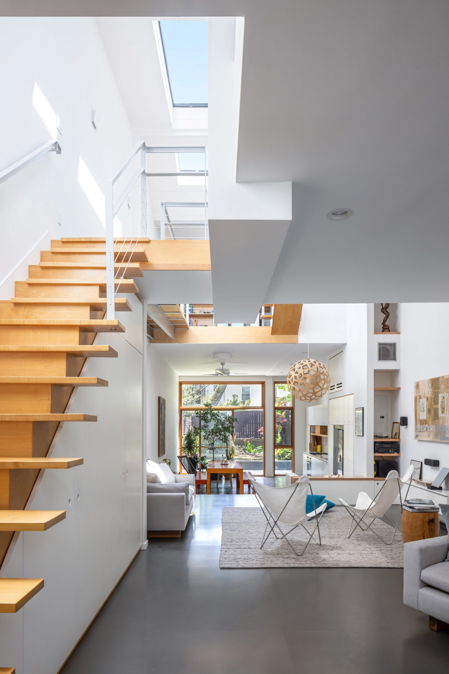 Maple staircase in white townhouse interior by Fanny and Matthew Mueller