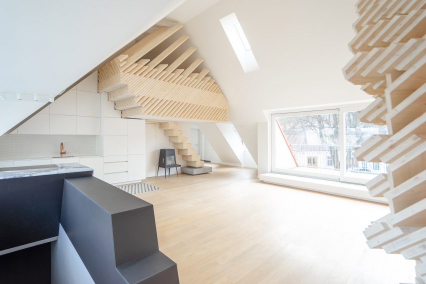 An attic apartment with timber structures inside