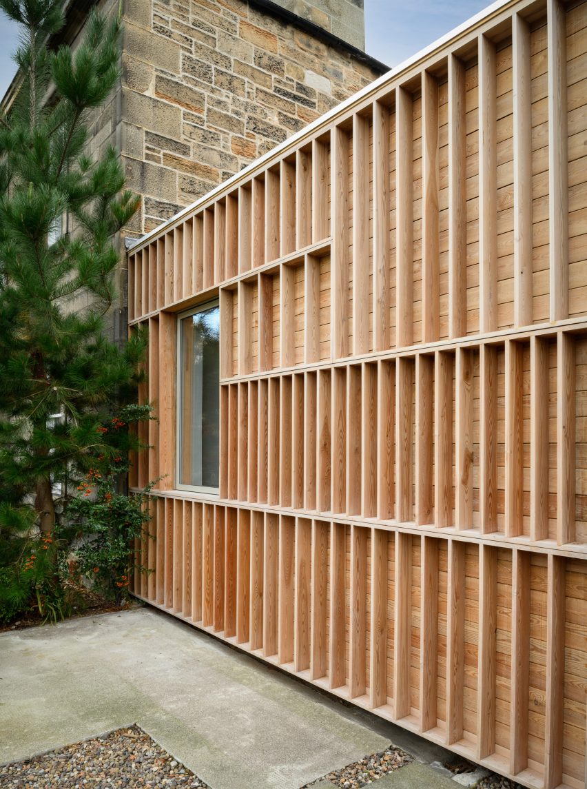 Photograph showing detail of garage frontage with timber fins visible