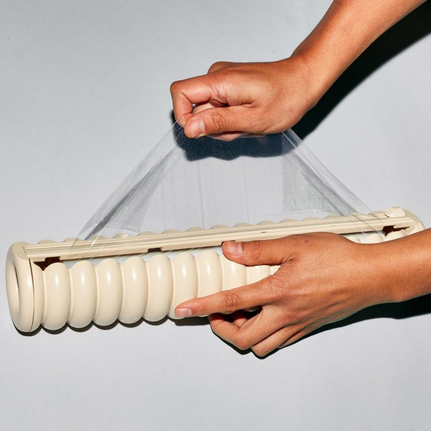 Two hands using Great Wrap bioplastic cling film