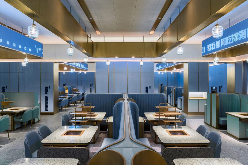 Shenzhen's Haidilao restaurant by Vermilion Zhou Design Group features blue-green interiors