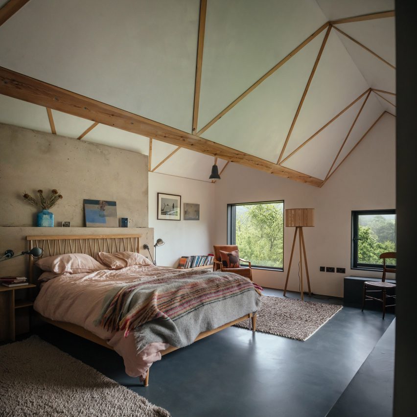 Bedroom with exposed timber trusses