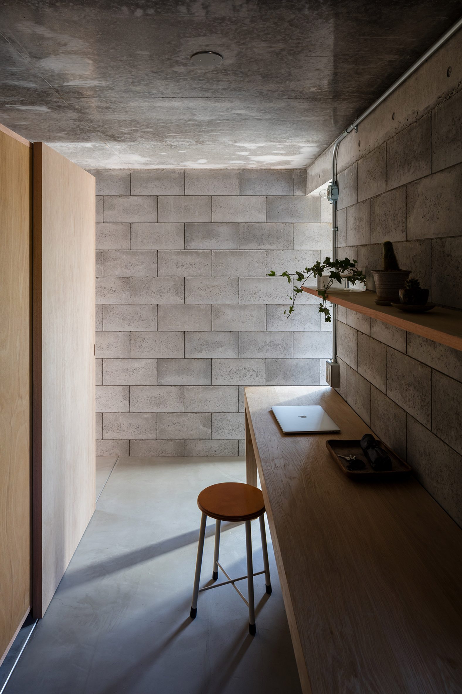 Study lined with exposed concrete blocks