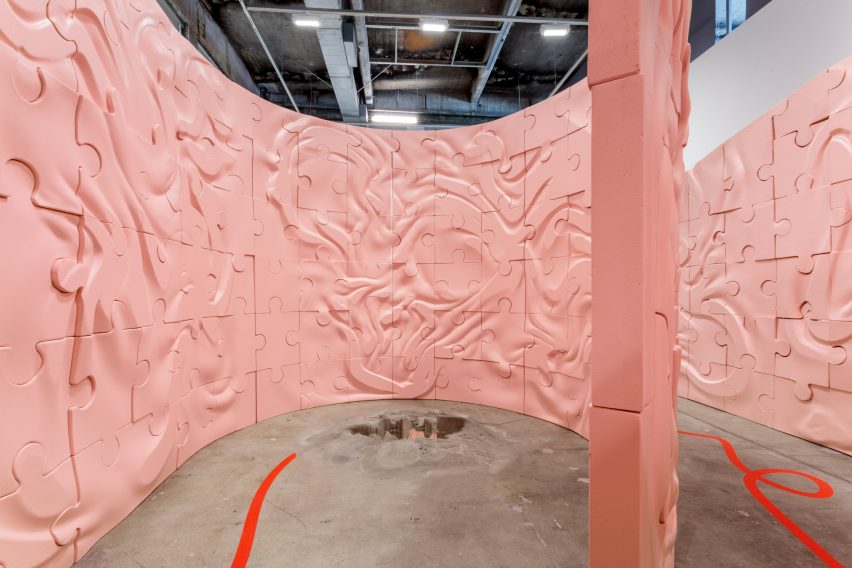 Curving pink labyrinth walls patterned with ridges