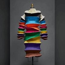 Image of a multi-coloured pleated dress by Issey Miyake