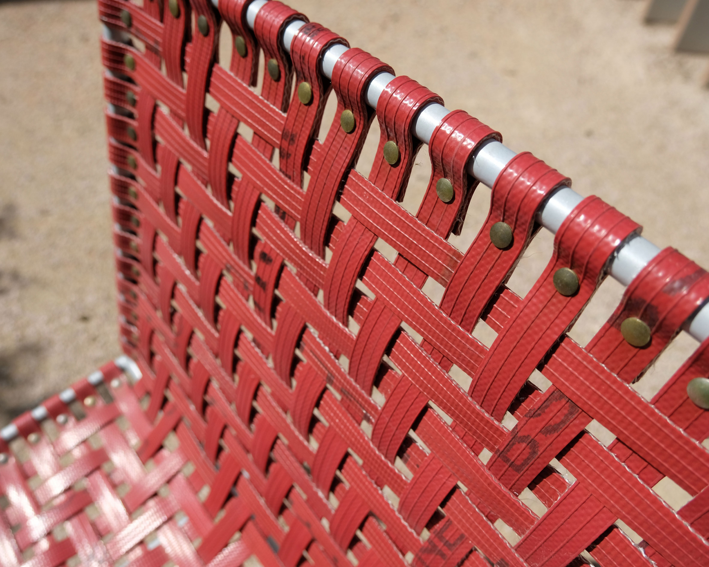 Close-up of woven seat made from red fire hoses at Maggie's Southampton