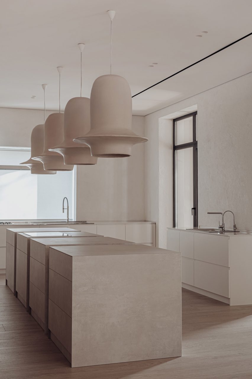 Kitchen of house in Kozyn, Ukraine, by Makhno Studio with sculptural pendant lights