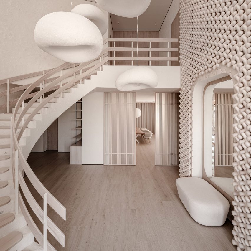 Foyer of Mureli House in Kozyn, Ukraine, by Makhno Studio with sweeping staircase and wall of 3D ceramic tiles