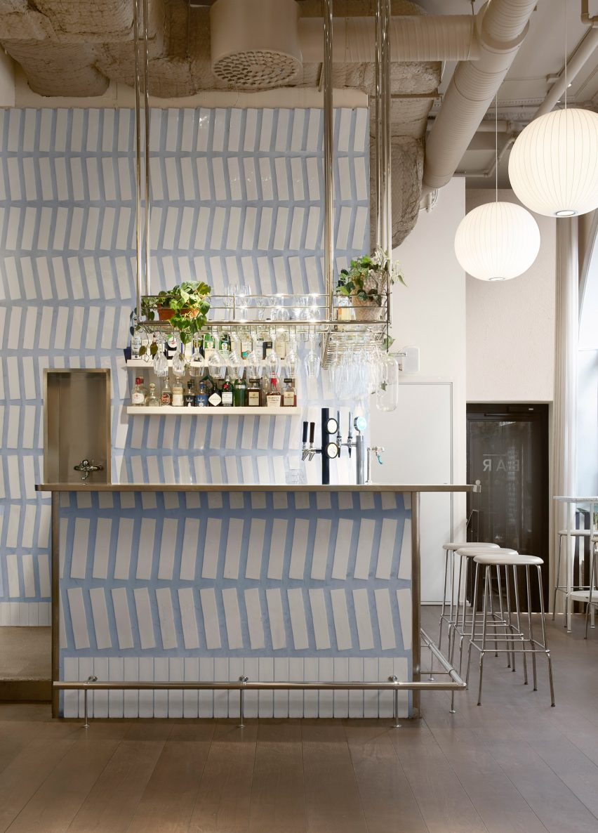 Tiled bar area of Tysta Mari restaurant with blue grouting