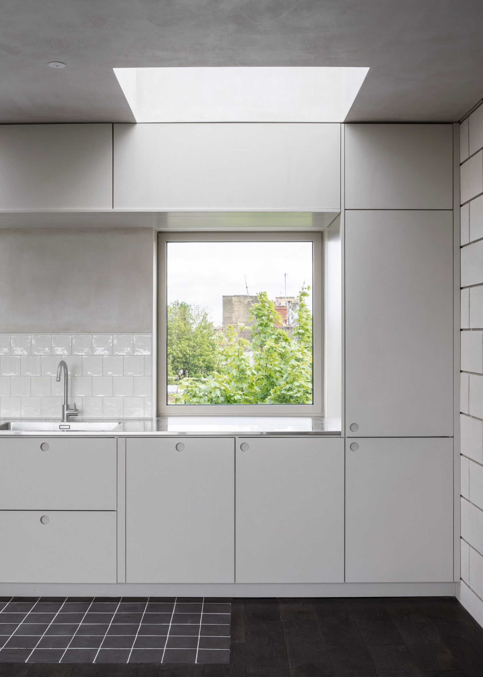White kitchen with plaster and blockwork walls