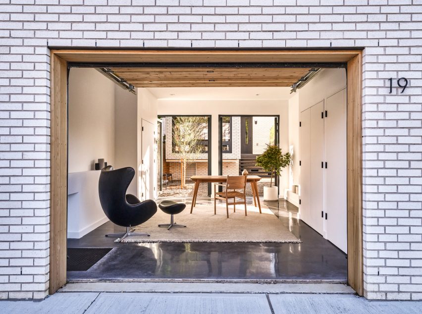 Garage converted into minimalistic study leading to courtyard