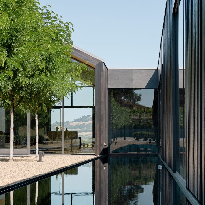 Photograph showing exterior of winery with reflection pools