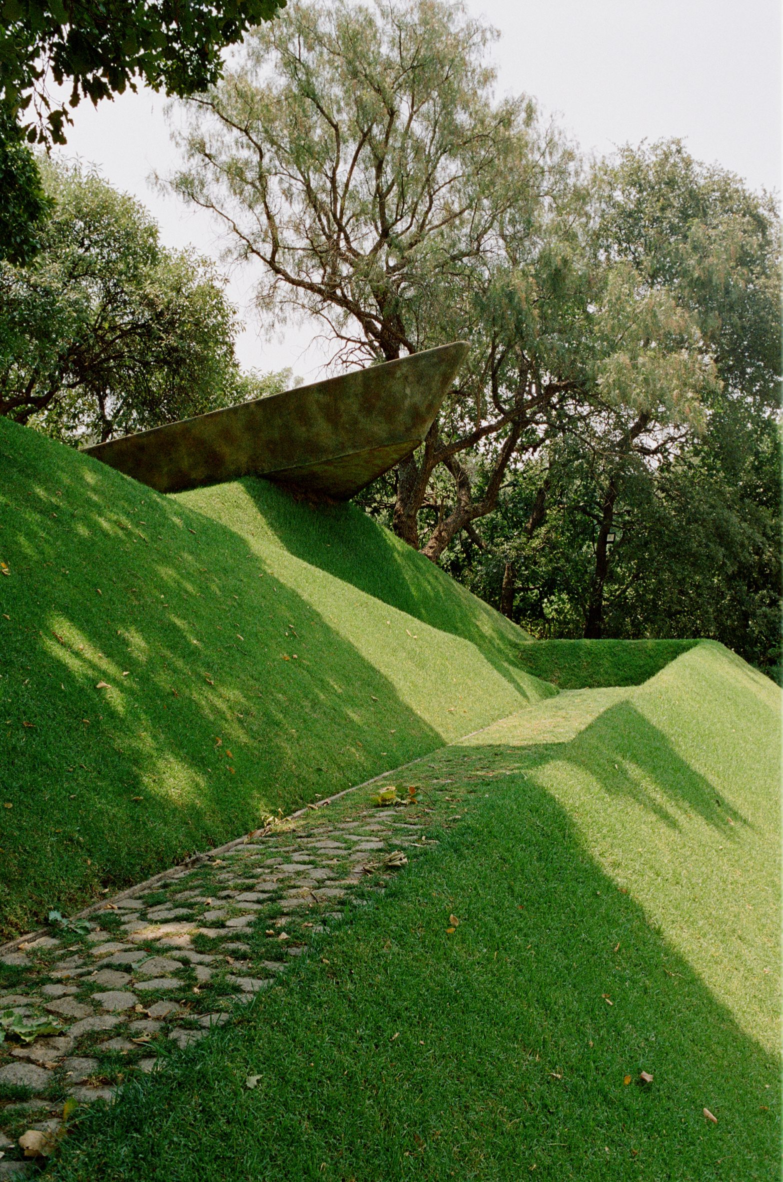 Sloped grassy hill with walkway