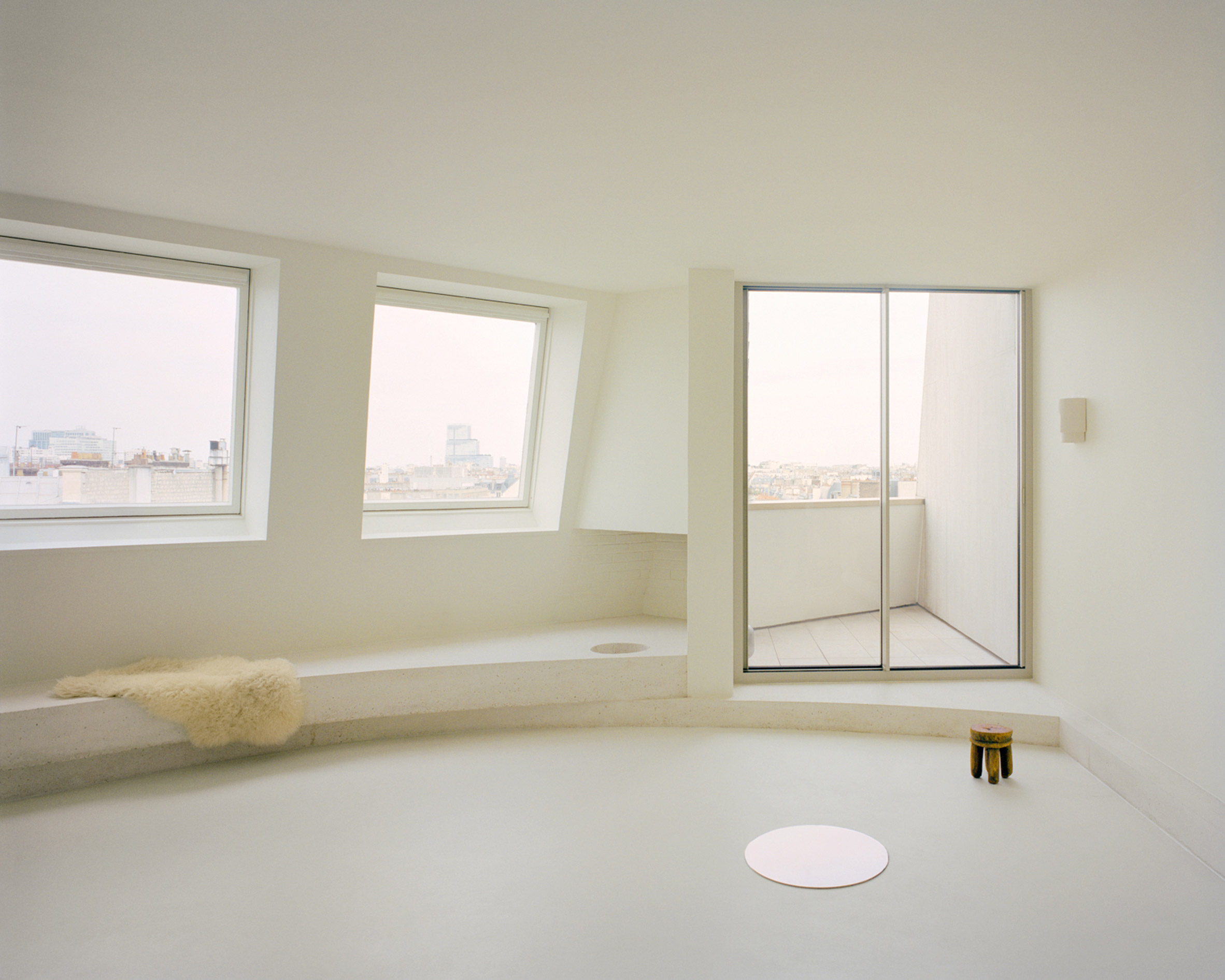 Interior image of a living space at The Edge with views across Paris