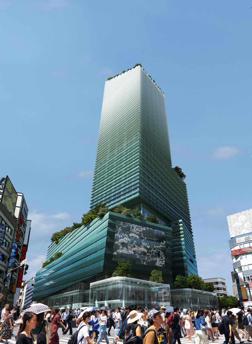 Tall tower in Tokyo with display screen and green roof