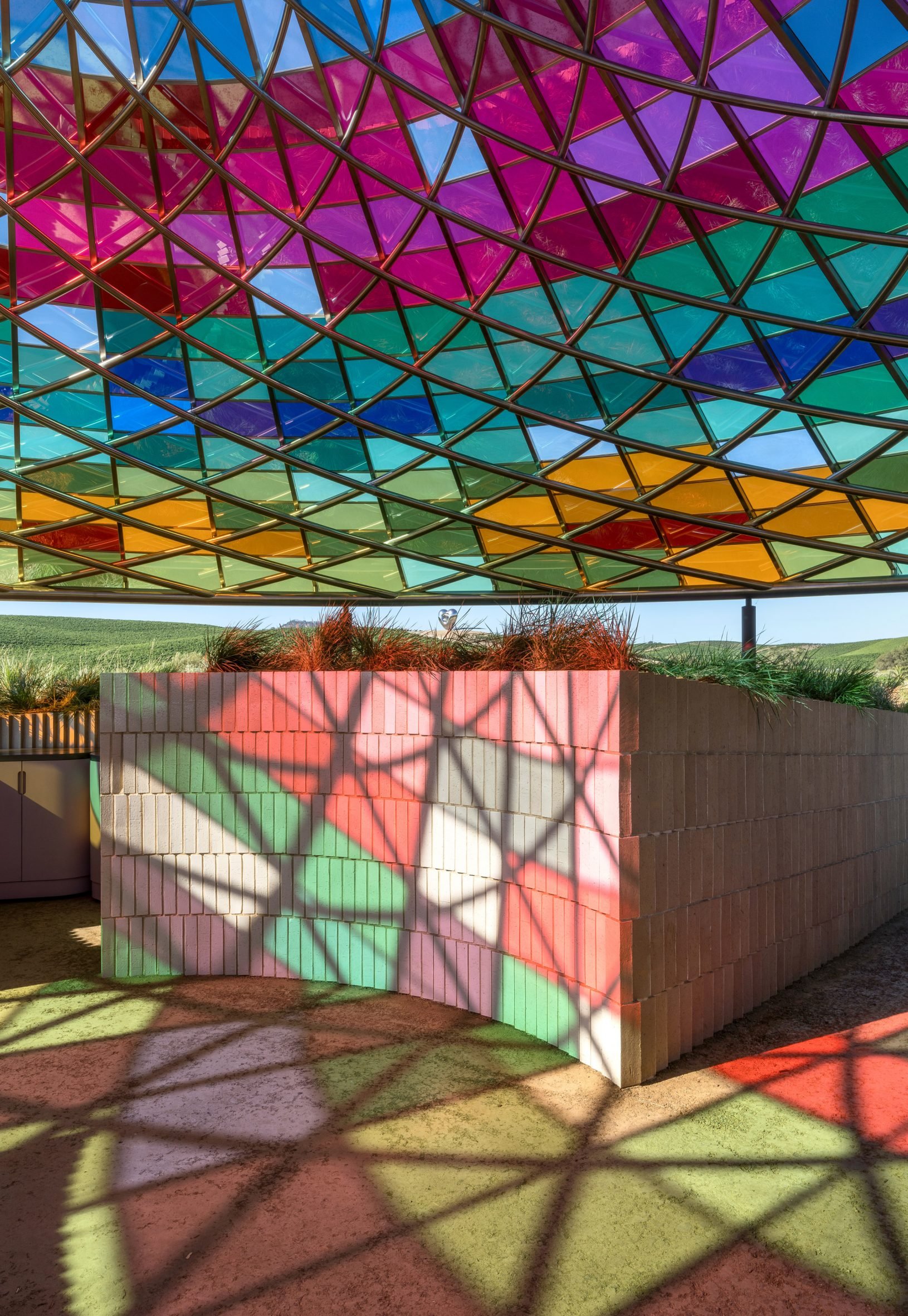 Image of light filtering through the coloured glass at Vertical Panorama Pavilion