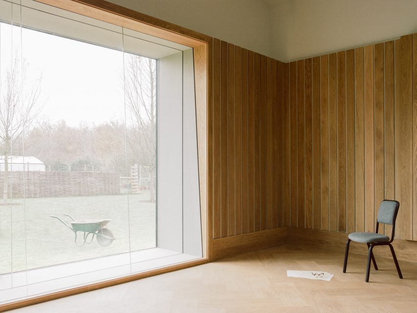 Wood-panelled recording studio with simple chair in Studio Richter Mahr in Oxfordshire