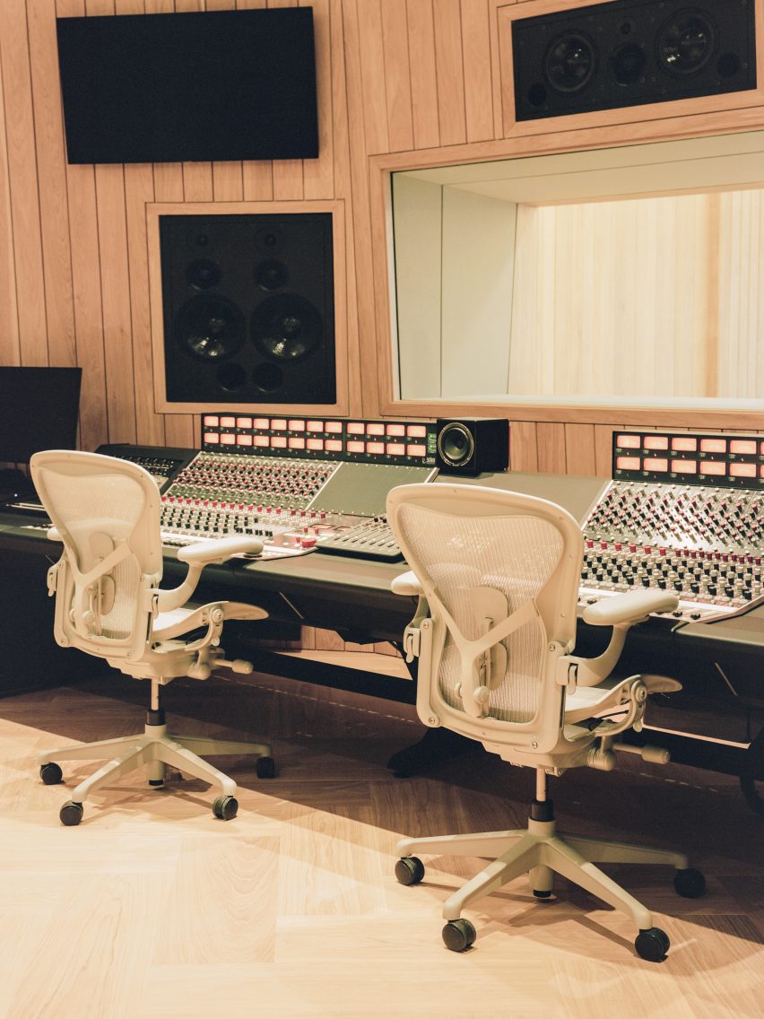 Recording studio with simple grey swivel chairs in recording studio by Charlie Luxton Design