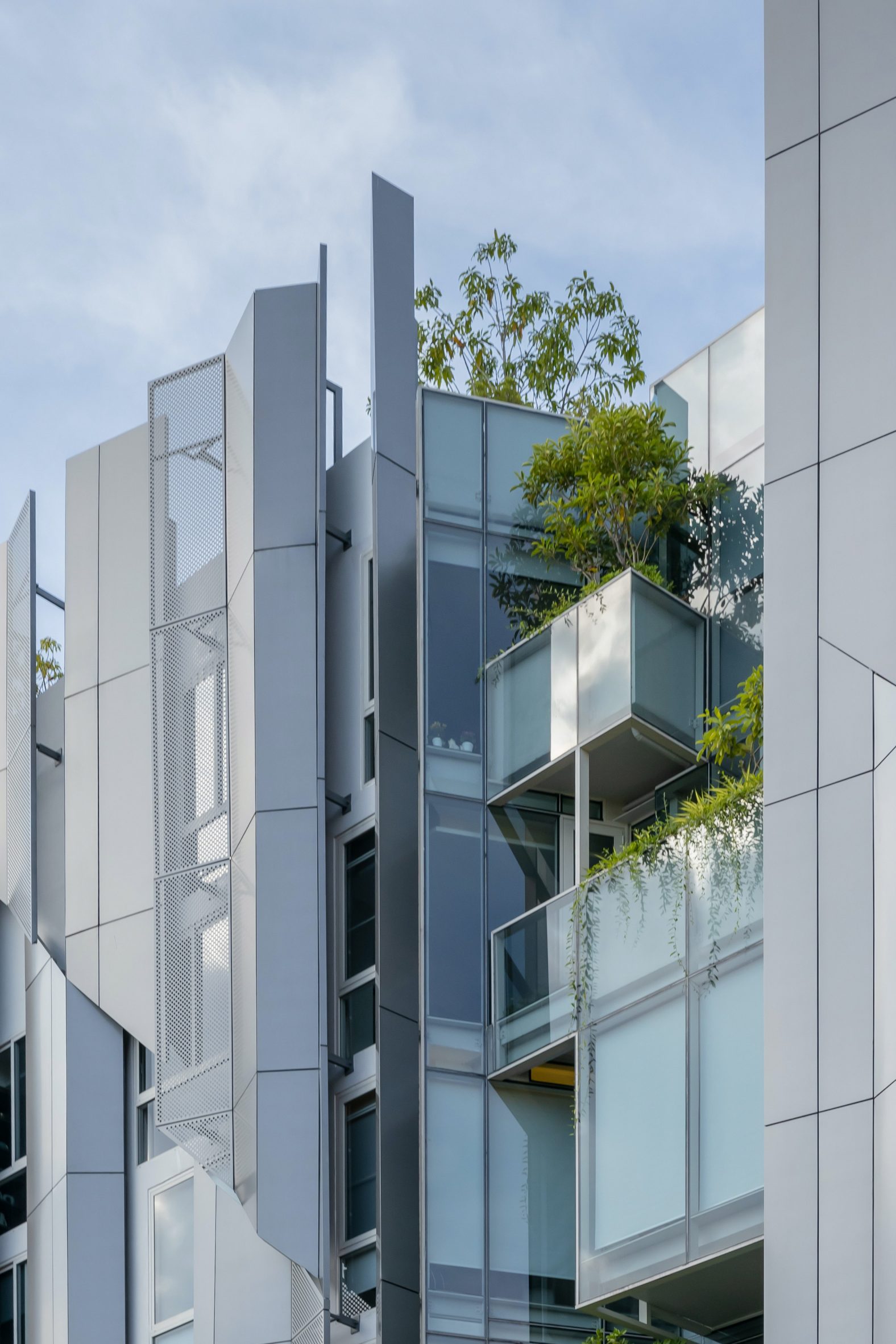 Angled metal facade of Suanphlu Office by IDIN Architects